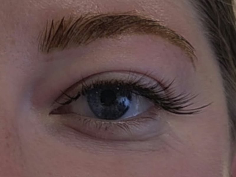 After: Designed lash extensions by CHIQUE AESTHETIC, blue eyes