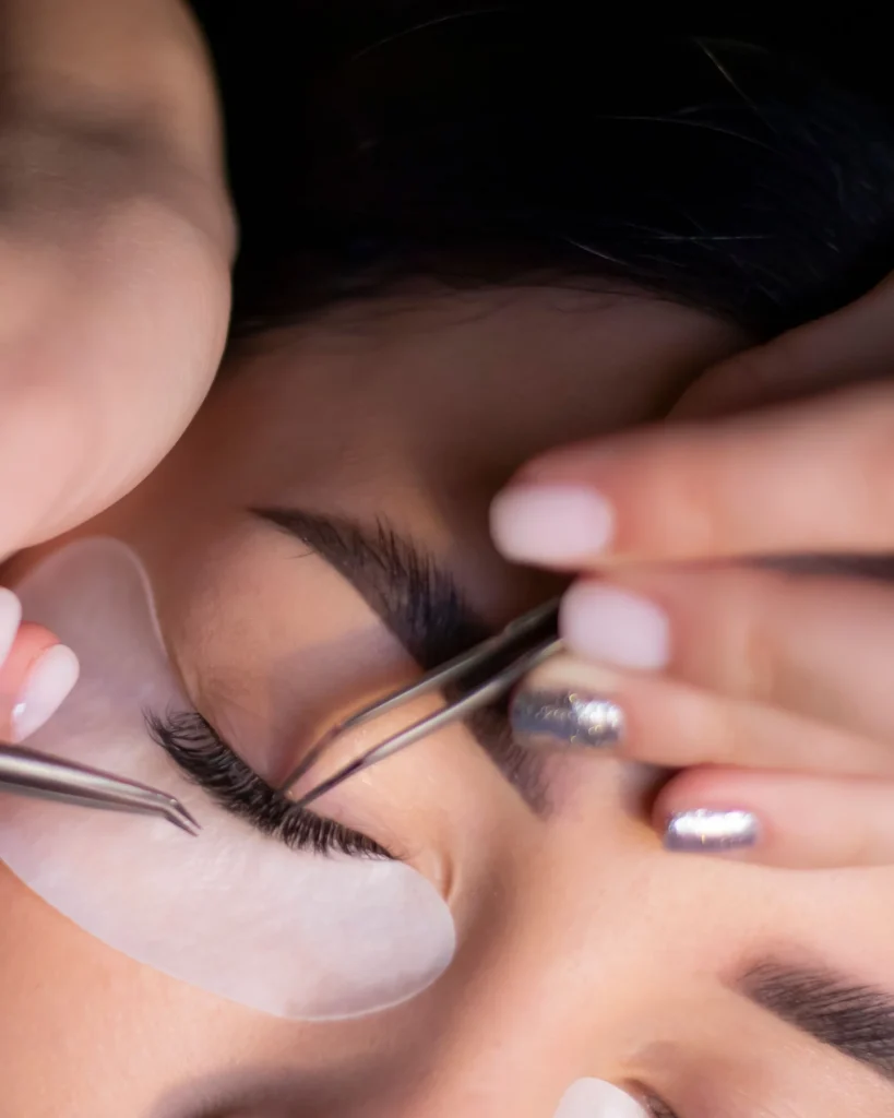 Close-up of soft natural lashes and glowing skin